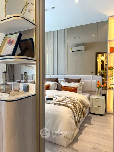 Luxurious modern bedroom with elegant decor and stylish shelving, perfect for a cozy retreat.