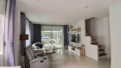Spacious modern living room with sleek design and natural light
