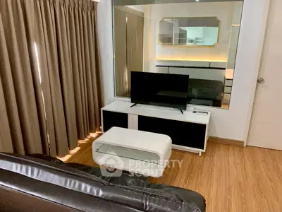 Modern living room with sleek furniture and wooden flooring