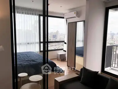Modern bedroom with city view and balcony access in high-rise apartment