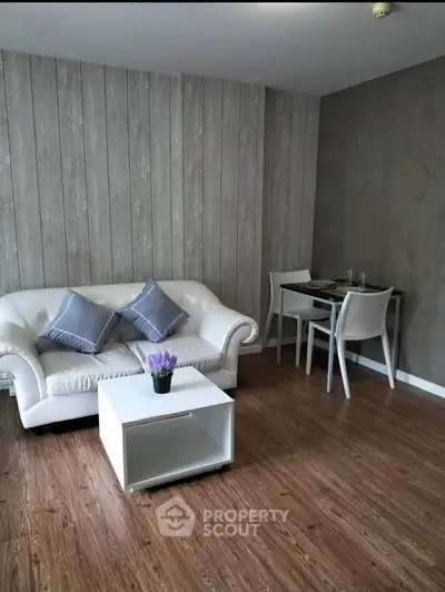 Modern living room with stylish furniture and wood flooring