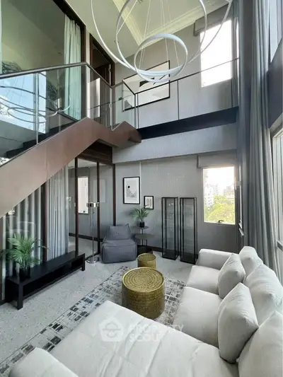 Luxurious modern living room with high ceilings and stylish decor