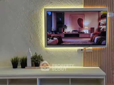 Modern living room with stylish TV setup and ambient lighting