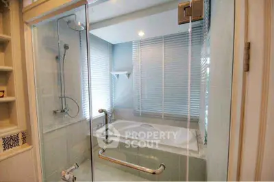 Luxurious bathroom with glass shower and modern bathtub