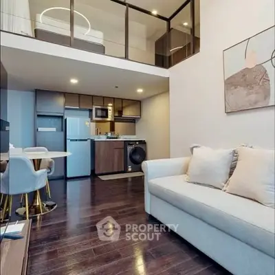 Modern loft apartment with open kitchen and stylish living area.