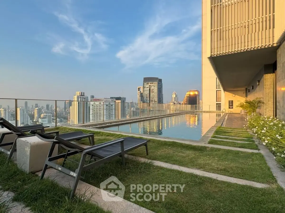 Stunning rooftop pool with city skyline view, perfect for luxury living.