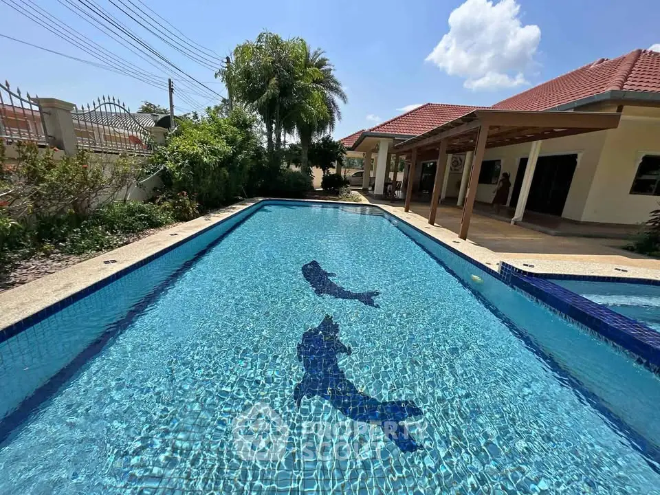 Stunning villa with a sparkling pool and lush garden, perfect for luxury living and entertaining.