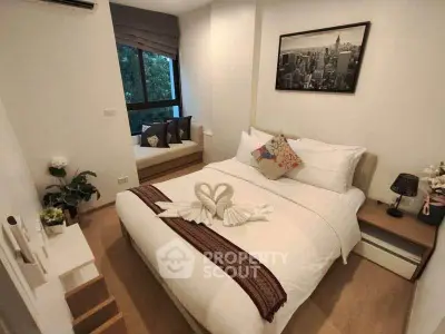 Cozy bedroom with elegant decor and large window view