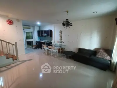 Spacious living room with modern kitchen and elegant decor