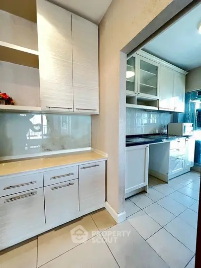 Modern kitchen with sleek cabinetry and ample counter space