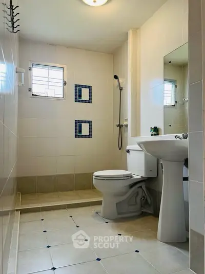 Modern bathroom with sleek fixtures and stylish tile accents