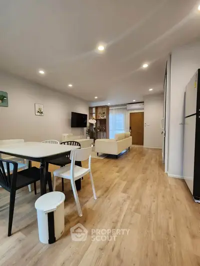 Spacious modern living room with elegant dining area and stylish decor