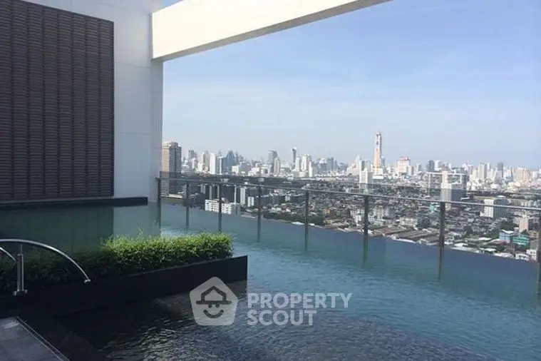 Stunning rooftop infinity pool with breathtaking city skyline view