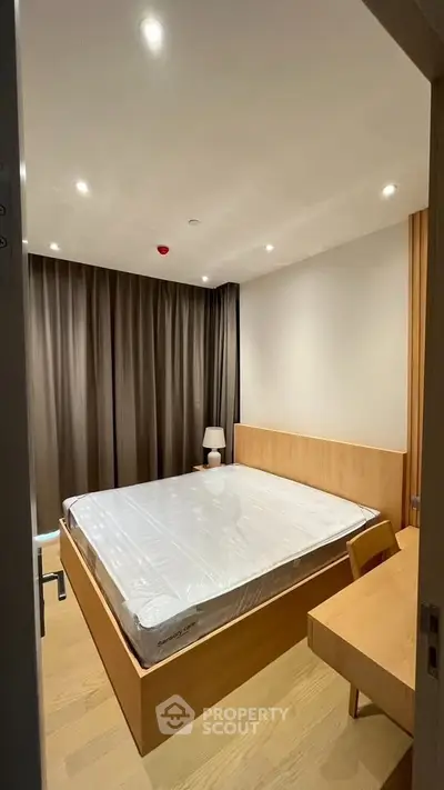 Modern bedroom with wooden furniture and ambient lighting