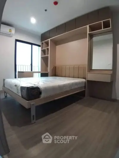 Modern bedroom with built-in storage and sleek design