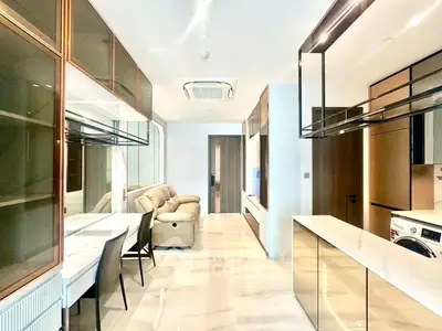 Luxurious modern living room with sleek design and elegant furnishings, featuring open layout and ample natural light.