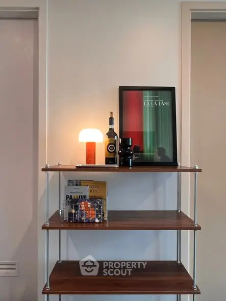 Stylish shelving unit with wine and decor in modern home interior