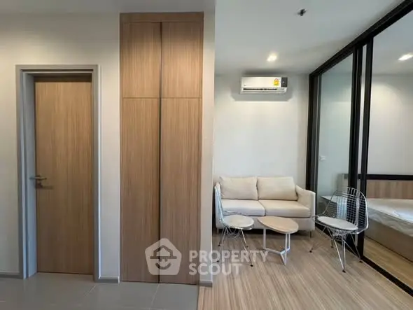 Modern living room with cozy seating and air conditioning