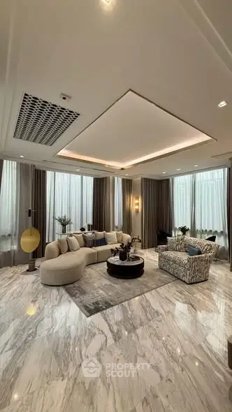 Luxurious living room with elegant marble flooring and modern furniture