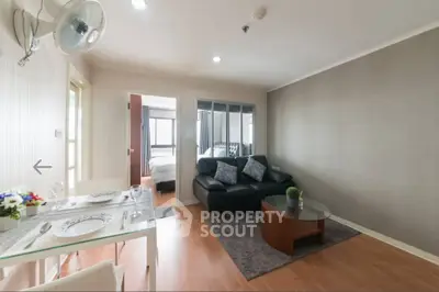 Modern living room with elegant decor and cozy seating area in a stylish apartment.