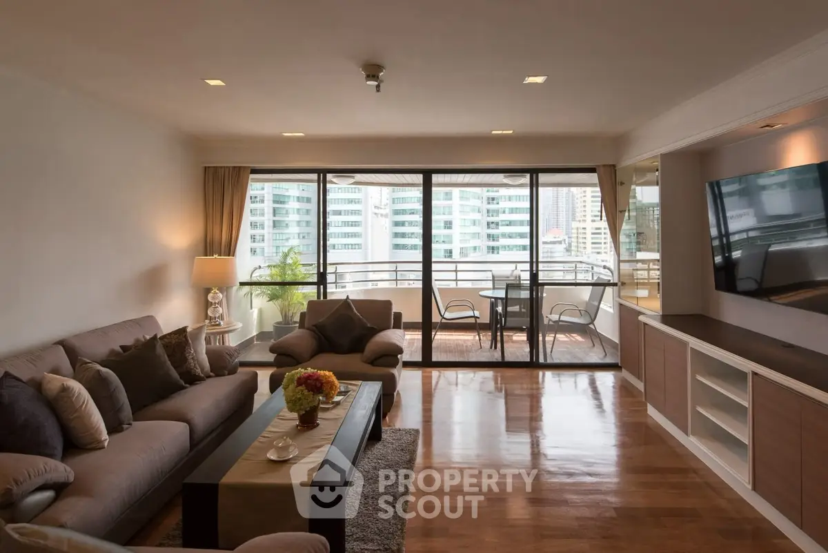 Spacious living room with balcony view in modern apartment