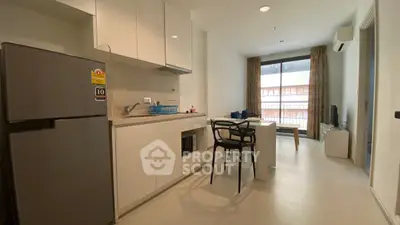 Modern apartment kitchen with open layout and dining area