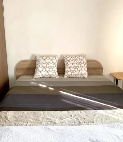 Cozy bedroom with stylish bedding and natural light