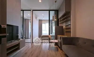 Modern living room with sleek design and cozy ambiance, featuring a stylish sofa and entertainment center.