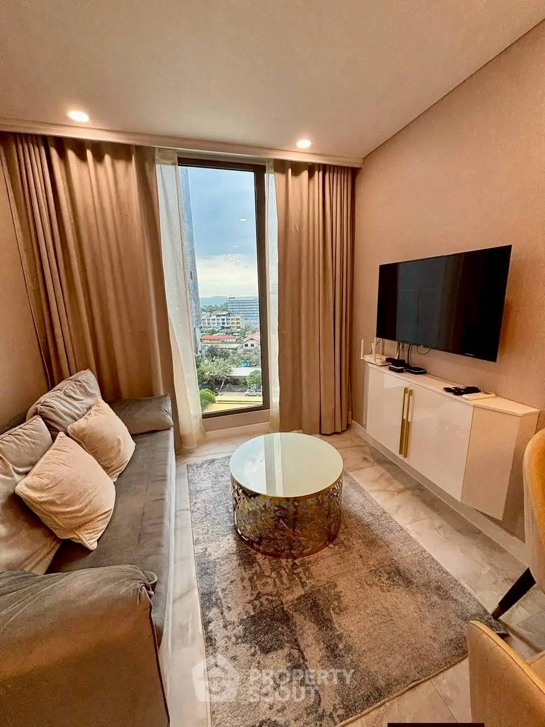 Modern living room with large window and stylish decor