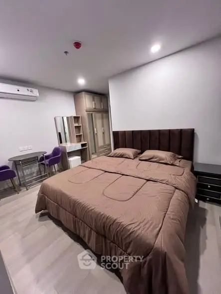 Modern bedroom with stylish furniture and cozy ambiance