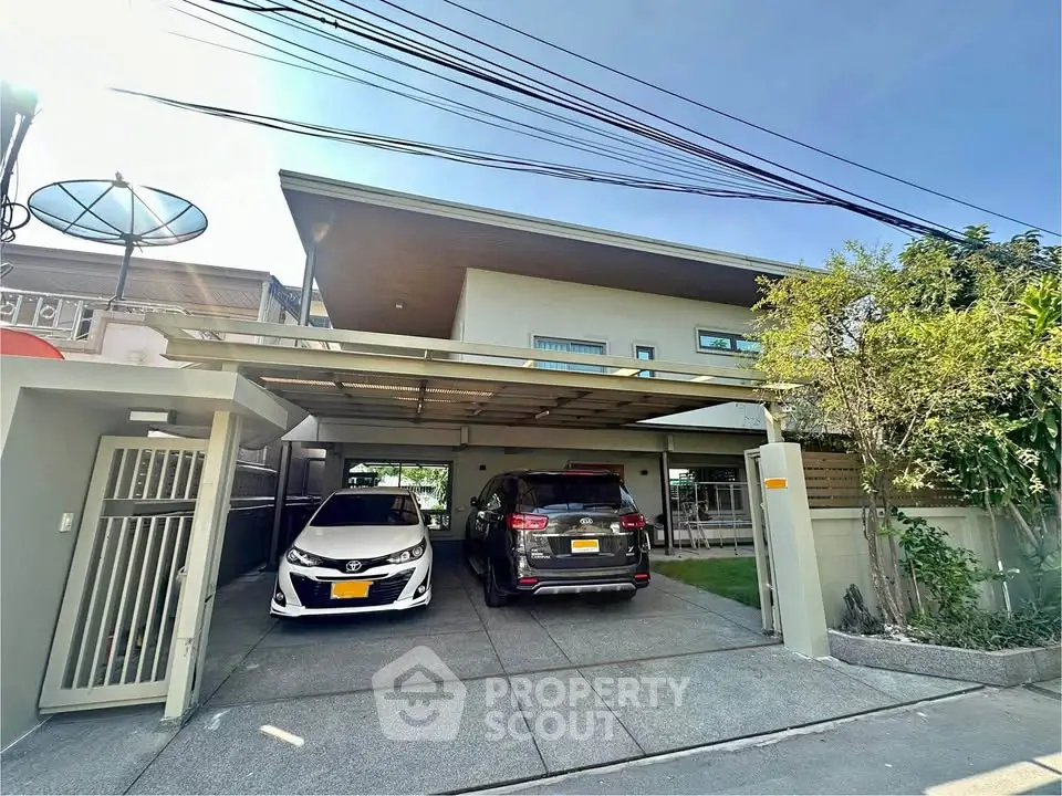 Modern two-car garage with sleek design and spacious driveway in suburban home.
