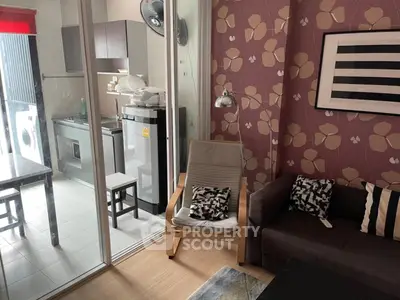 Chic living room with floral wallpaper and modern kitchen view