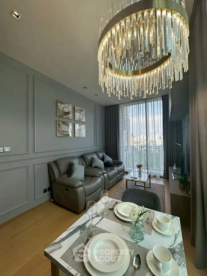 Luxurious living room with elegant chandelier and modern decor