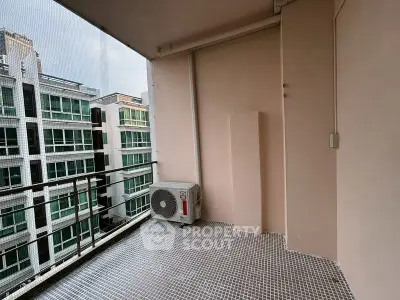 Spacious balcony with city view in modern apartment building