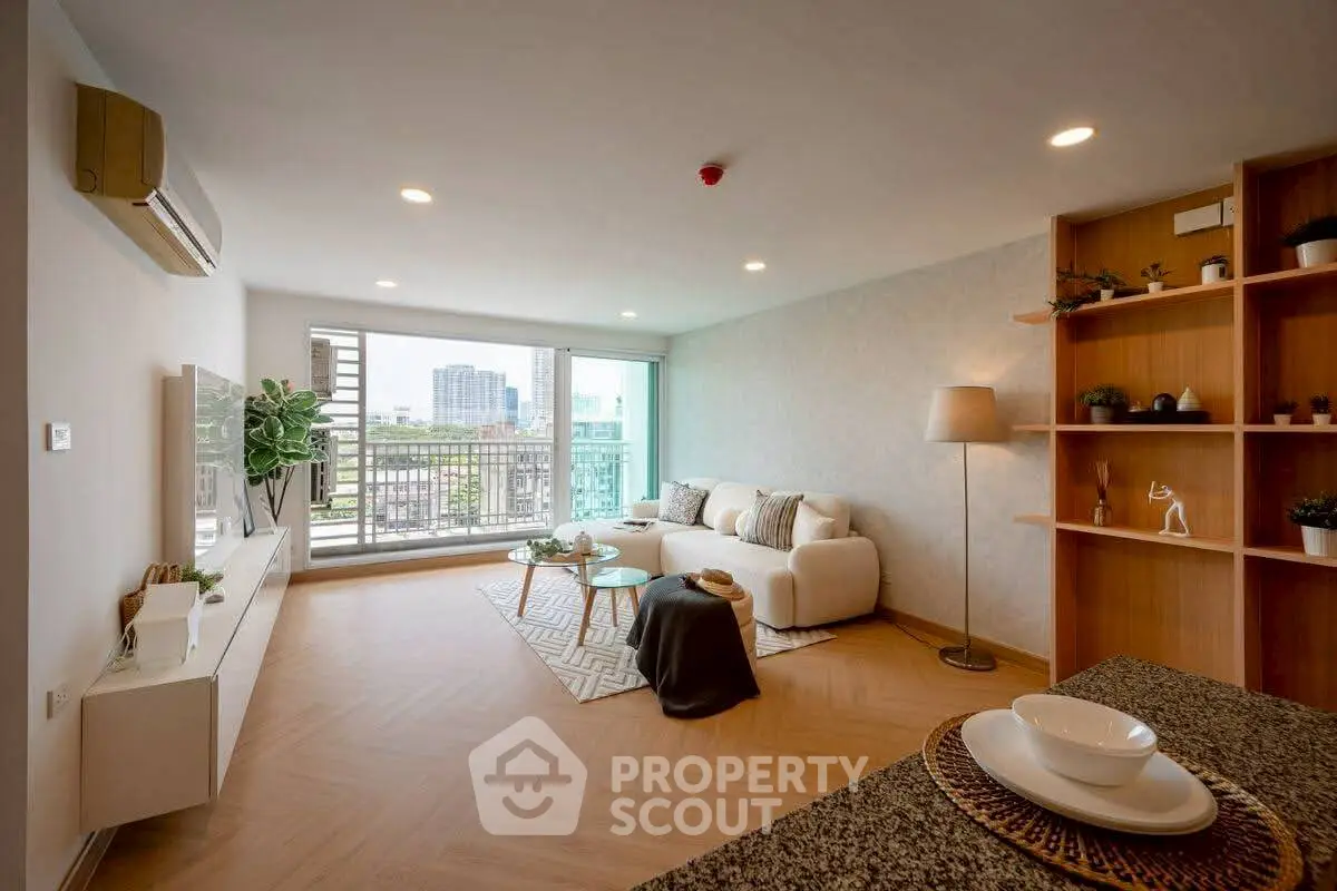 Spacious modern living room with large windows and stylish decor