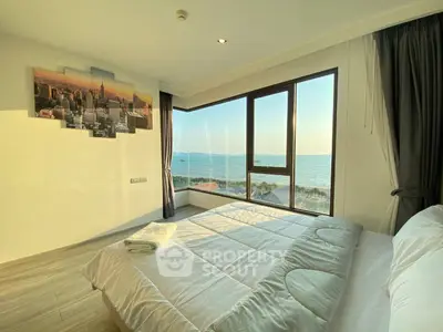 Luxurious bedroom with stunning ocean view and modern decor