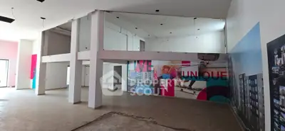 Spacious commercial property with high ceilings and modern design elements, ideal for businesses seeking a unique space.