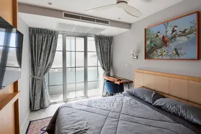 Cozy bedroom with balcony access and elegant decor