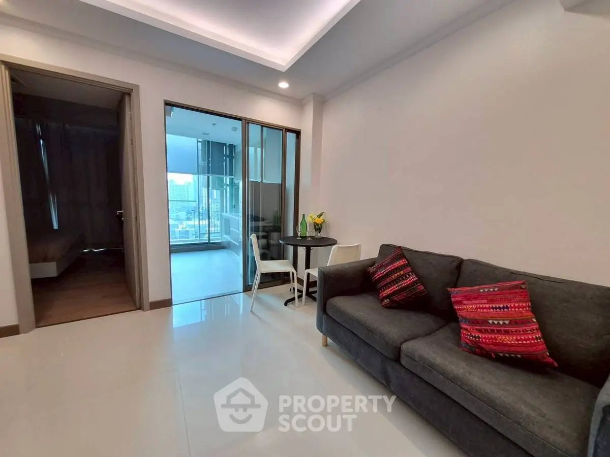 Modern living room with sleek design and cozy seating area.