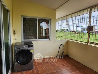 Spacious balcony with washing machine and scenic view