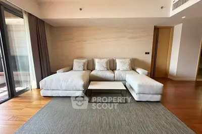 Spacious modern living room with elegant sofa and natural light