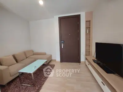 Modern living room with cozy sofa and sleek TV setup
