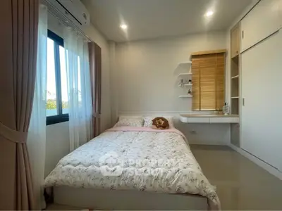 Cozy bedroom with natural light and modern decor