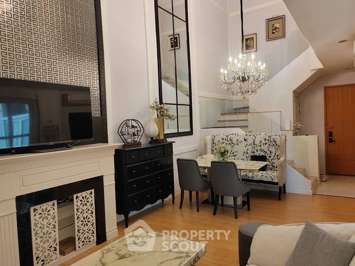 Luxurious living room with elegant chandelier and modern decor