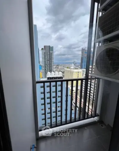 High-rise balcony with stunning cityscape view and modern architecture.