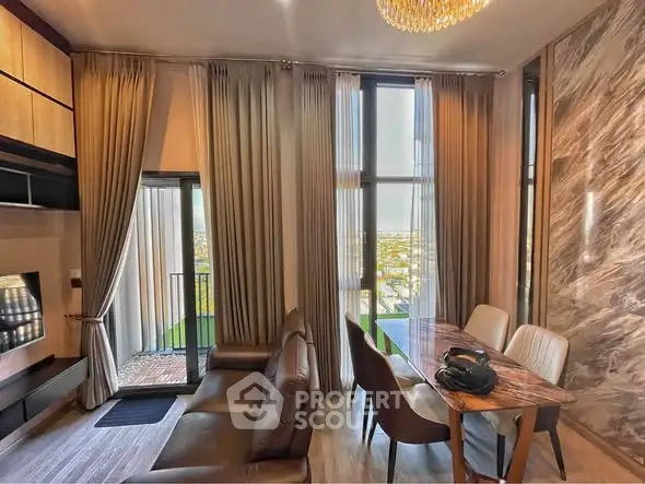Luxurious living room with elegant decor and stunning city view from balcony.
