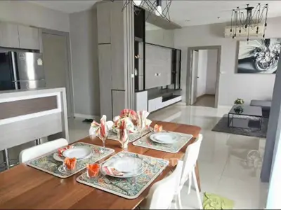 Modern open-plan living and dining area with stylish decor and contemporary furniture.