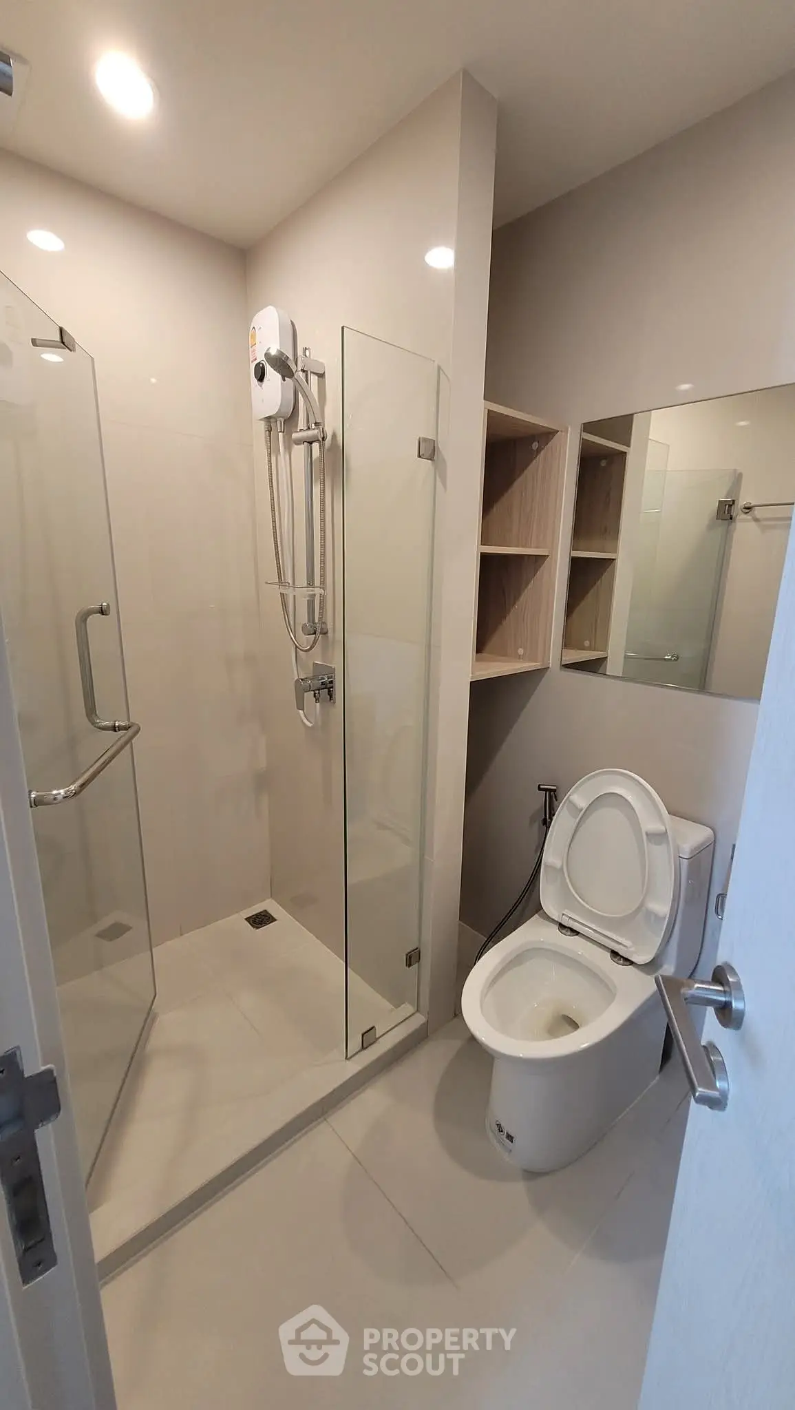 Modern bathroom with glass shower and sleek fixtures