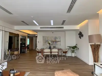 Spacious modern living room with elegant dining area and stylish decor