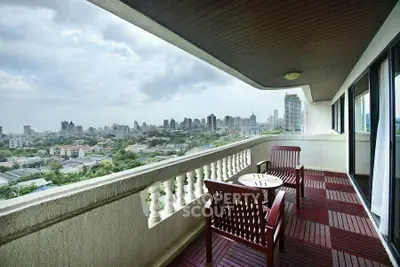 Spacious balcony with stunning city view, perfect for relaxation and entertainment.